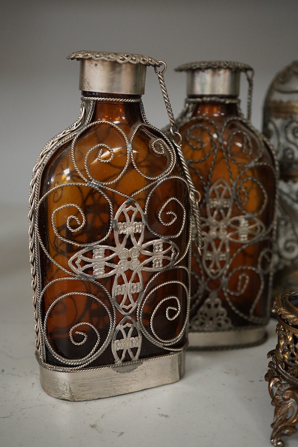 A collection of continental glass and wire worked bottles and flasks and a gilt metal onyx trinket box, tallest 19.5cm